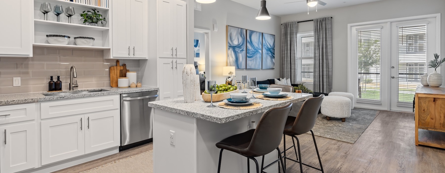 a kitchen with white cabinets