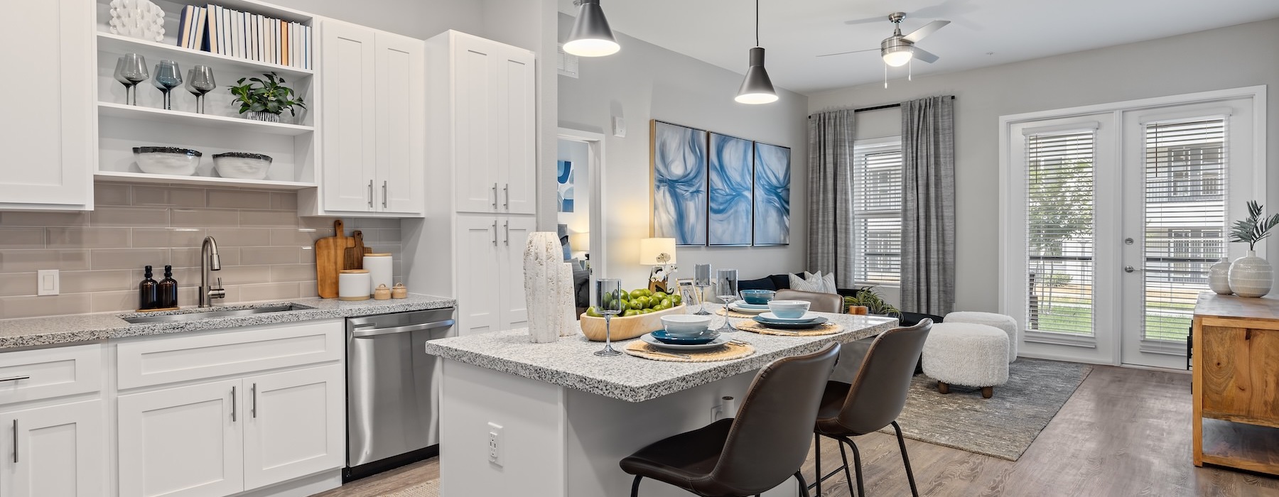 a kitchen with white cabinets