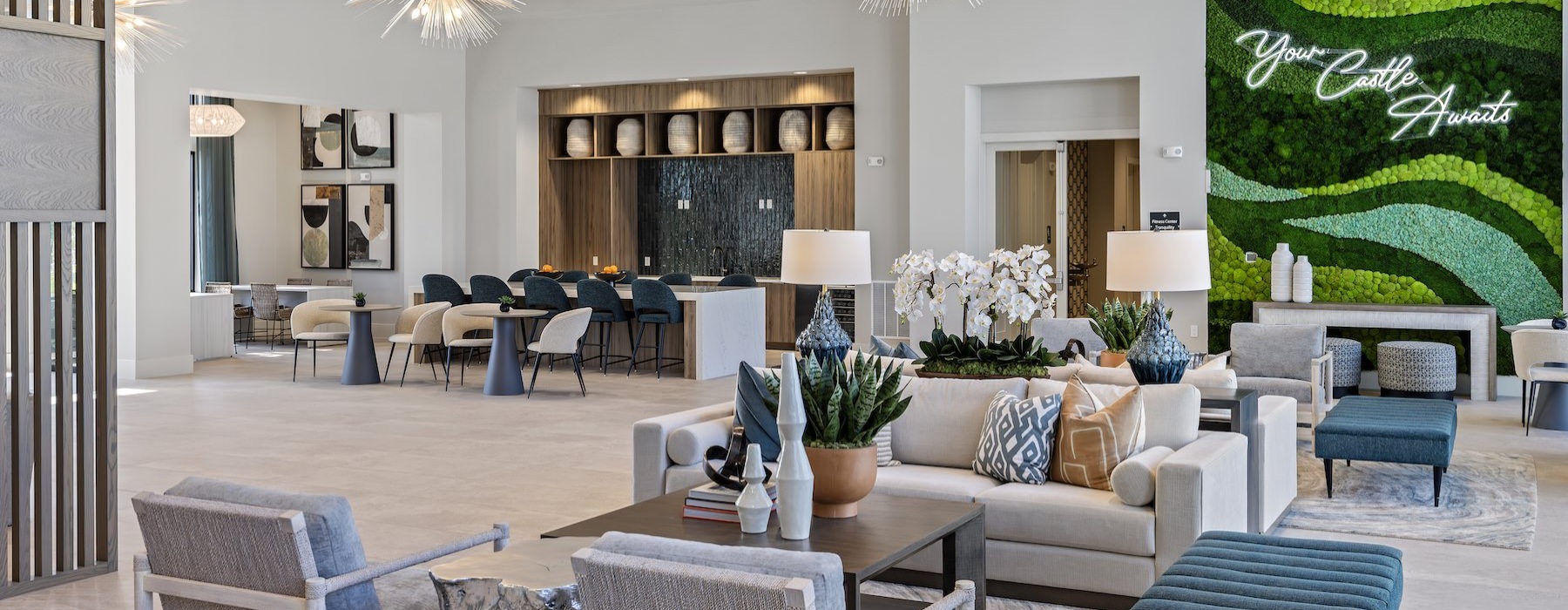 a clubroom with couches, tables and chairs