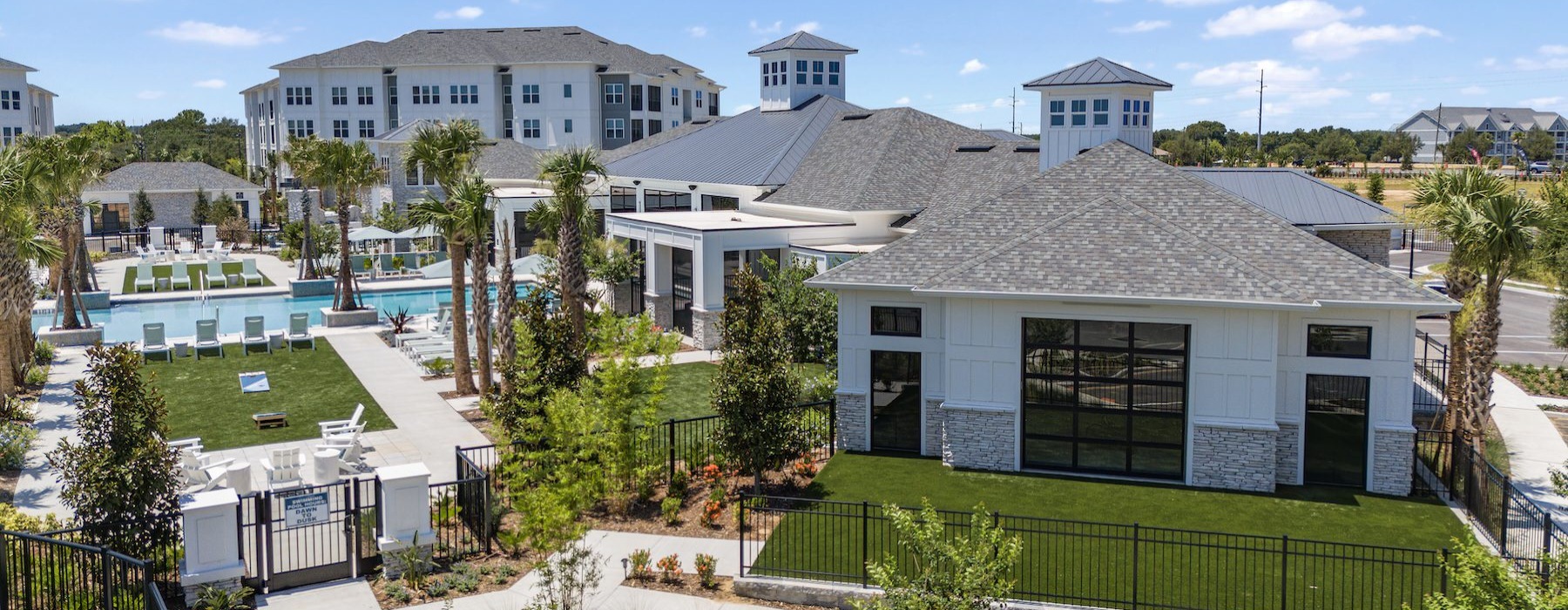 a building with a green lawn