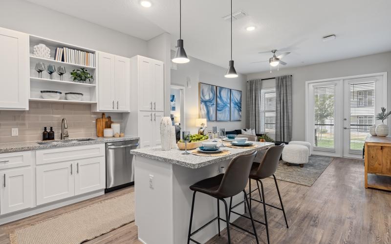a kitchen with white cabinets
